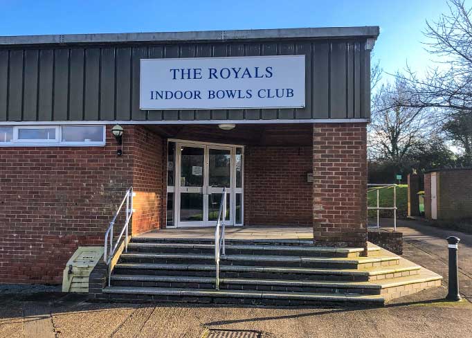 Entrance to the bowls club with steps and ramp
