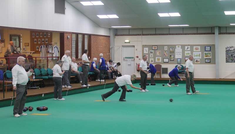 An indoor bowling match being played
