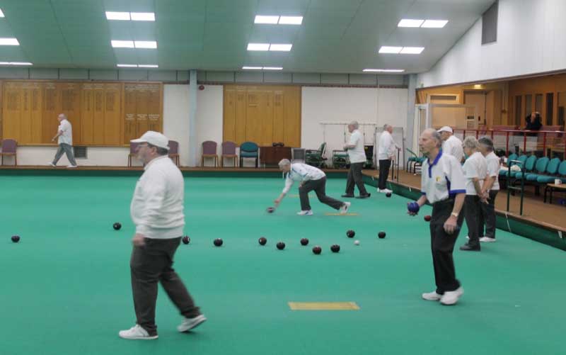 Bowlers on the rink at Tunbridge Wells Indoor Bowls Club