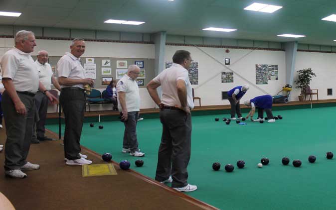 Bowlers on the rink at Tunbridge Wells Indoor Bowls Club